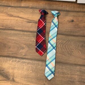 Two toddler ties, one turquoise & blue plaid and the other red & blue plaid